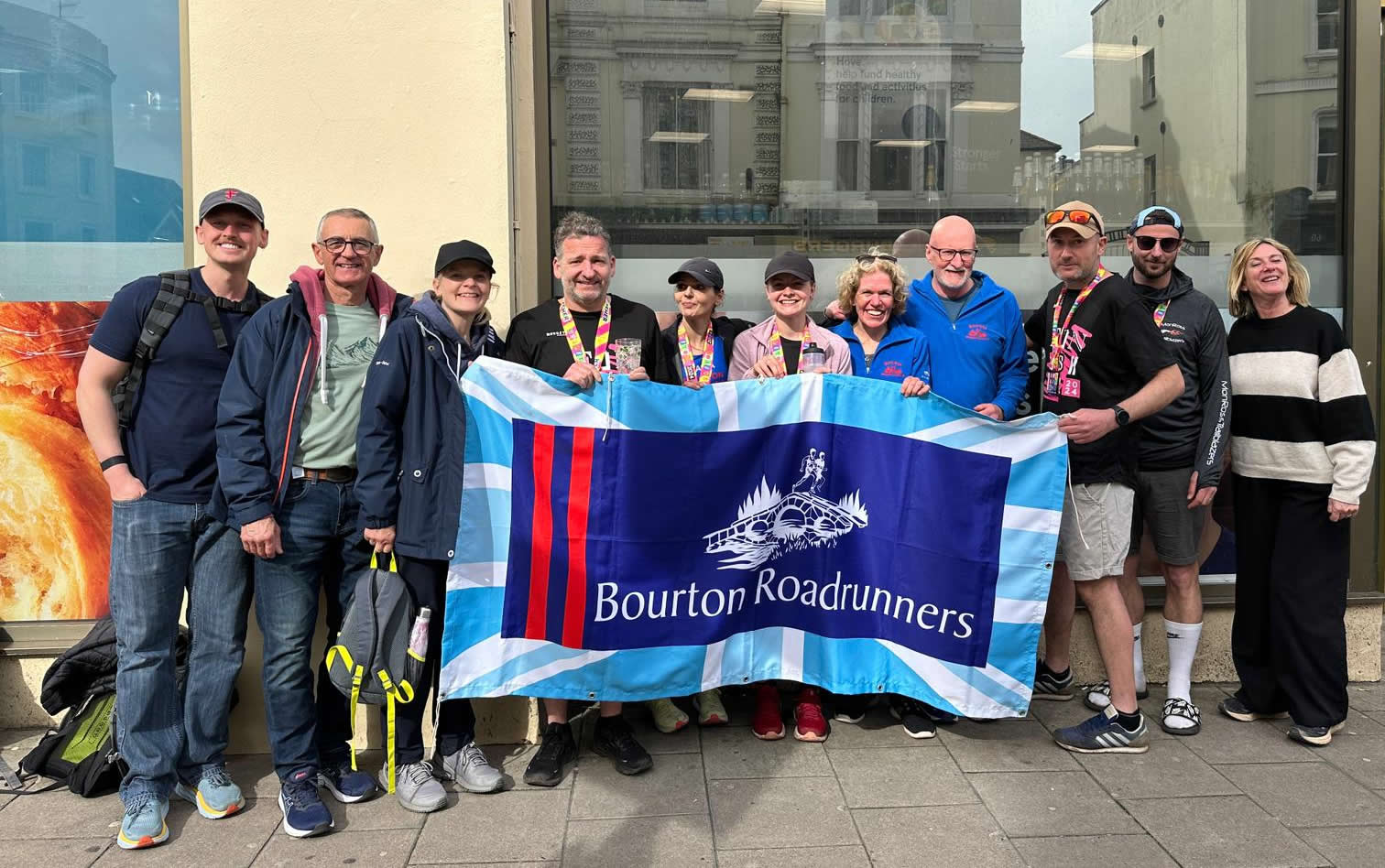 Bourton Roadrunners team at Brighton Marathon with supporters - 7-04-2024