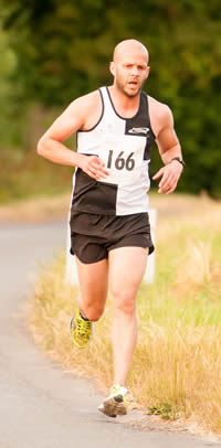 Race winner Luke Byrne of Swindon Harriers