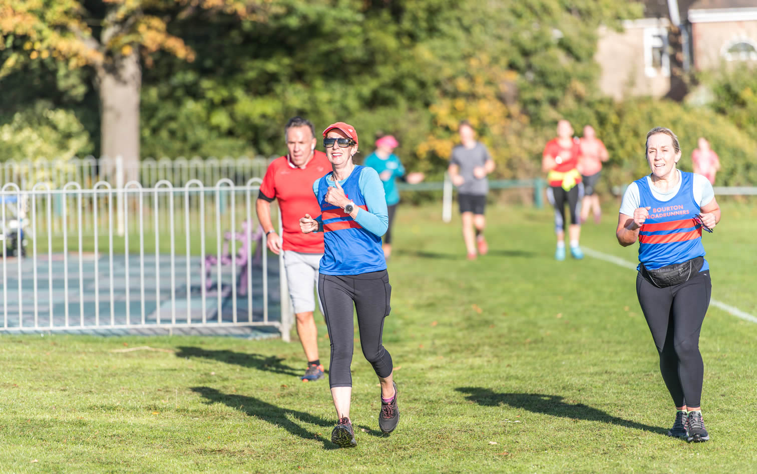 Bourton's Chris Lynch & Gillian James finishing at King George V Playing Field parkrun, Cheltenham - 8-10-2022